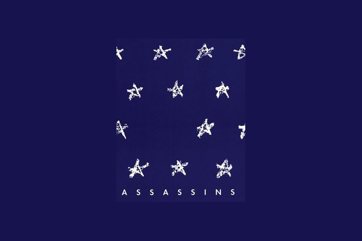 Assassins musical poster with white stars arranged in rows on dark blue background with ASSASSINS text below